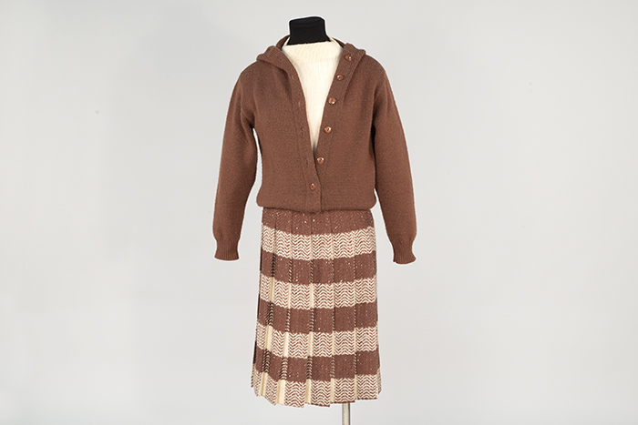 Image of Sweater and skirt ensemble, modeled in the Seattle World's Fair Fashion Pavilion, 1962